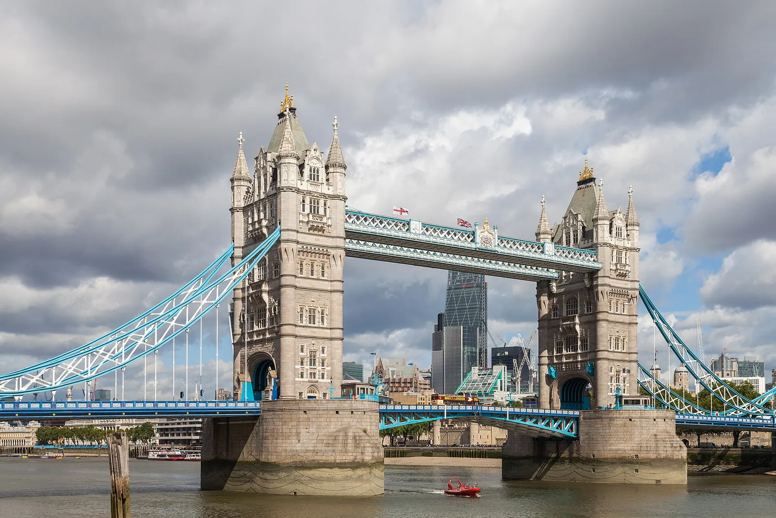 Tower Bridge spanning the Thames under a blue sky