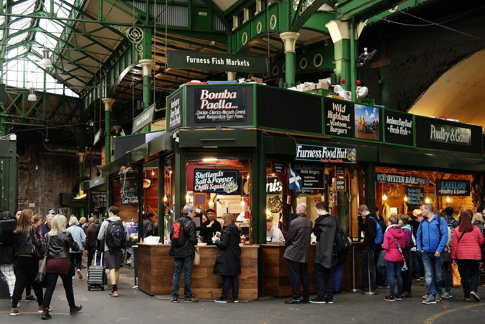 Busy food stalls inside Borough Market