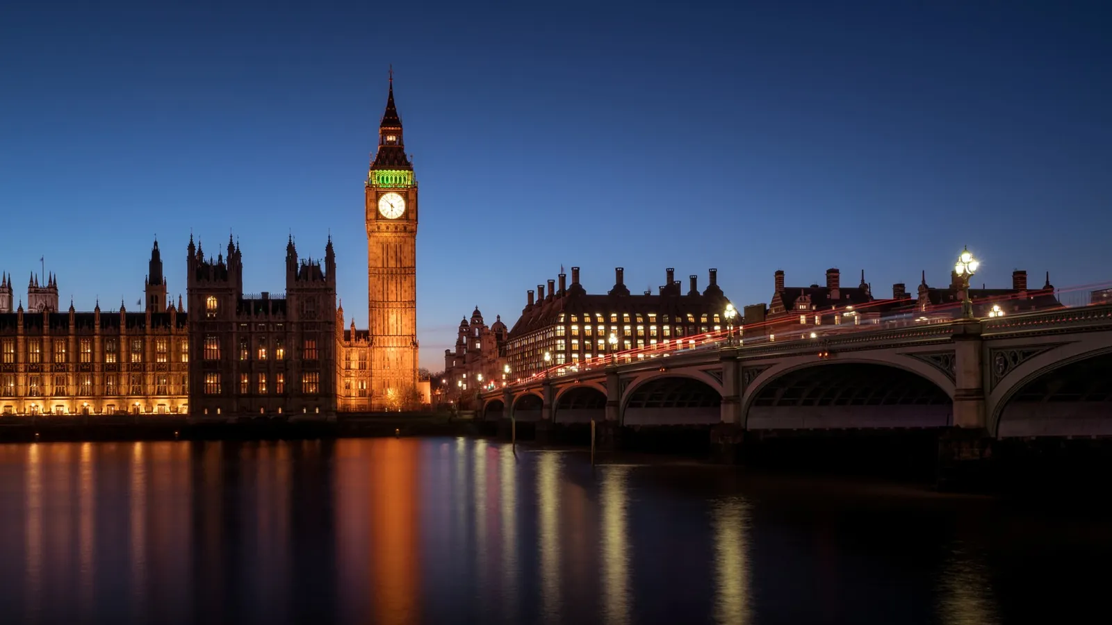 Houses of Parliament and Big Ben glowing over the Thames