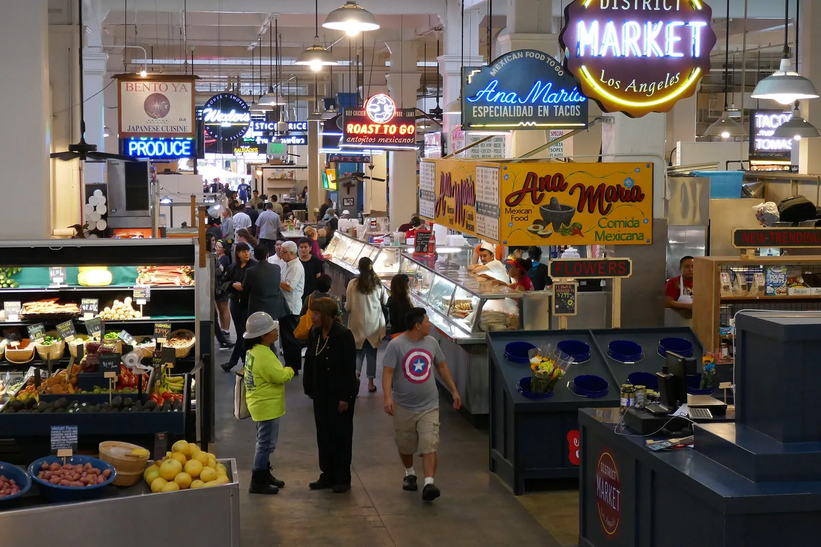Neon signs and food stalls inside Grand Central Market