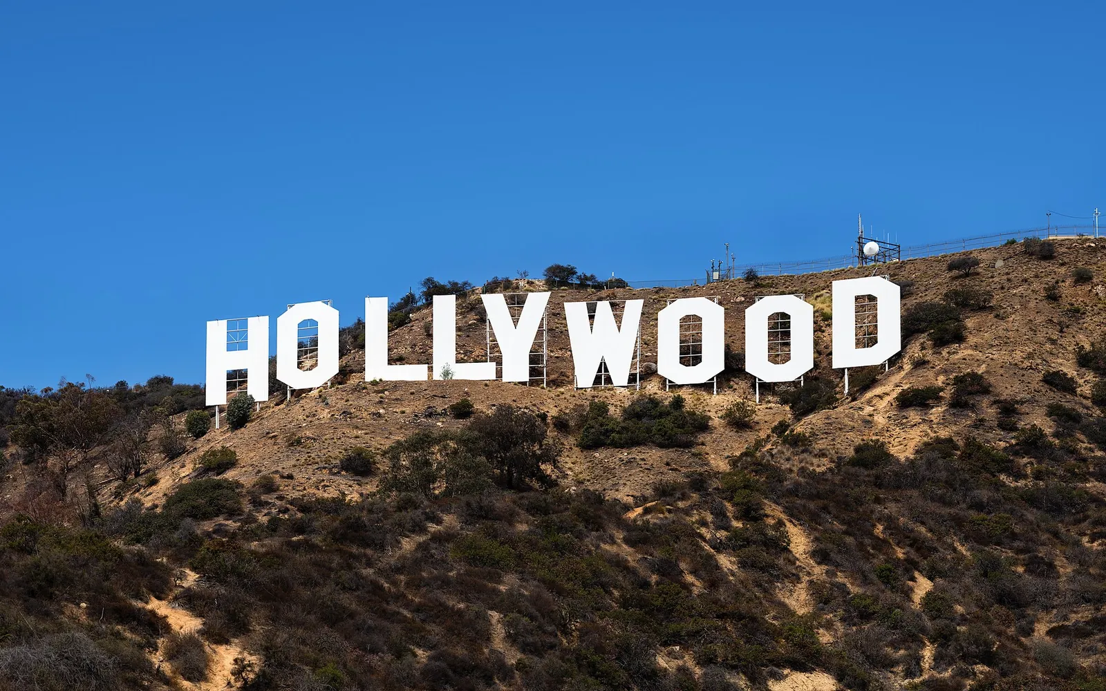The Hollywood Sign under a deep blue sky