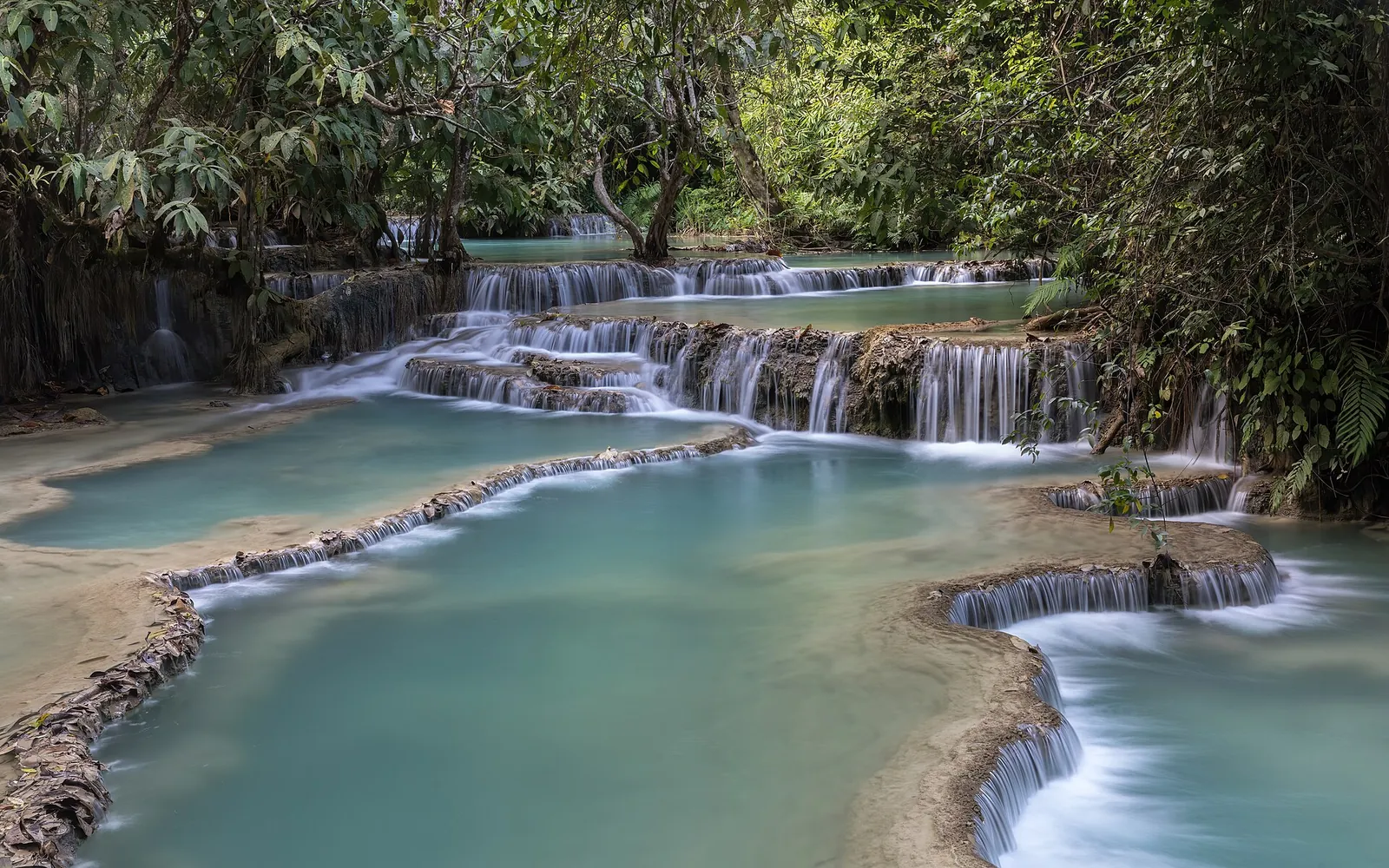 Tiered turquoise pools at Kuang Si Falls