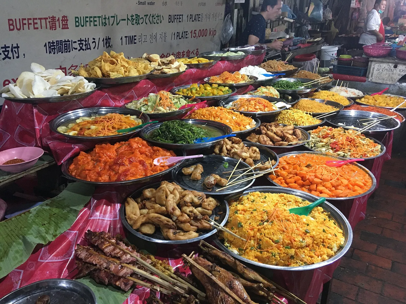Colourful dishes at a Luang Prabang night market buffet