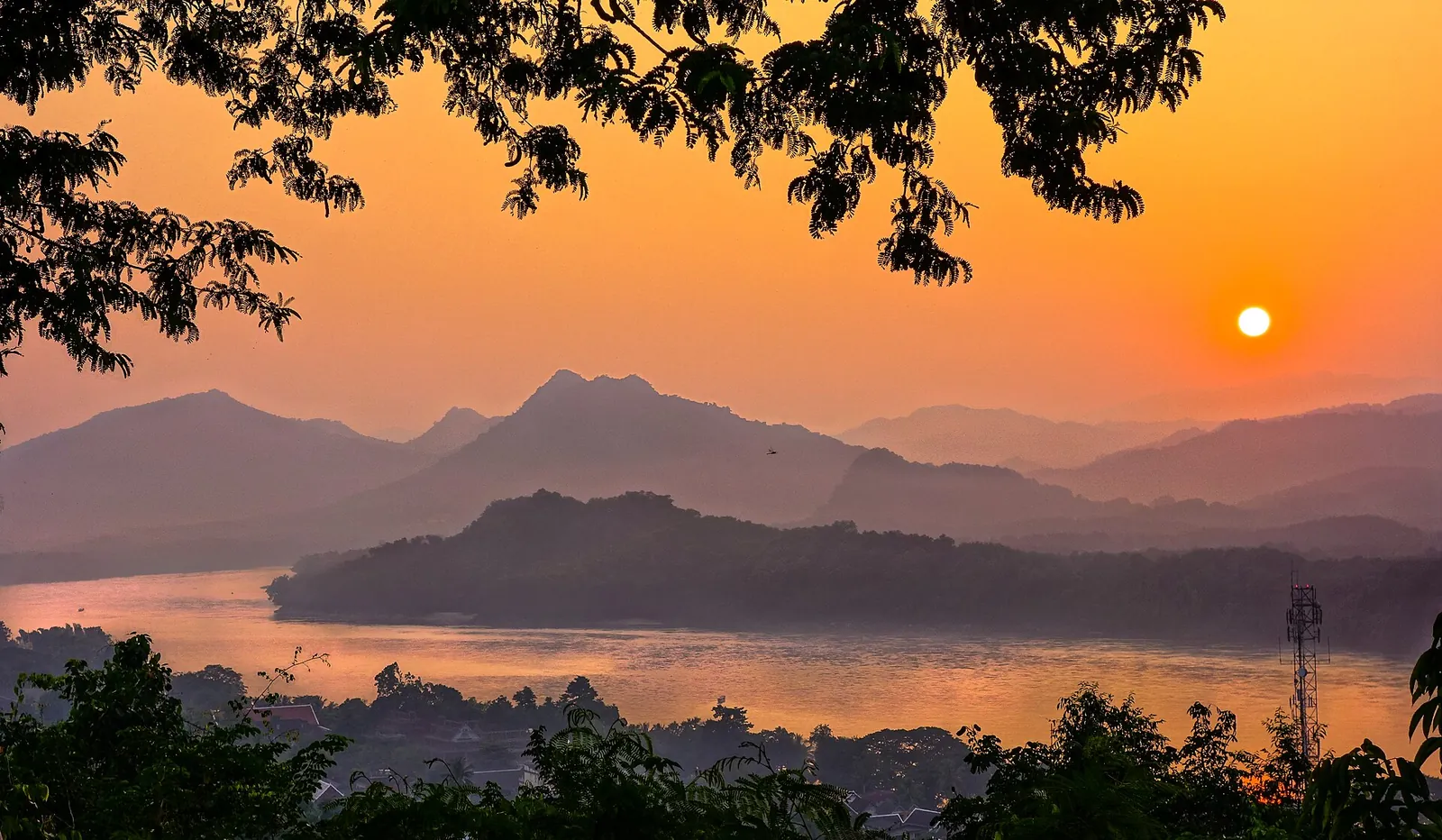 Golden sunset over the Mekong and the hills