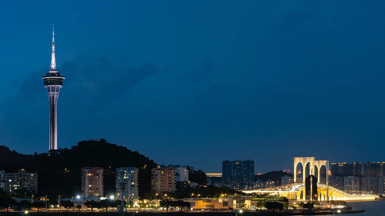 Macau Tower and Sai Van Bridge lit up at blue hour