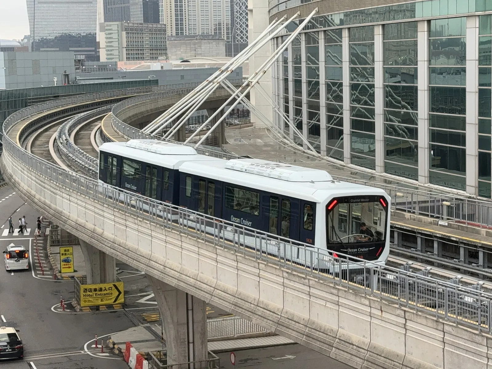 An LRT Taipa Line train gliding along its viaduct