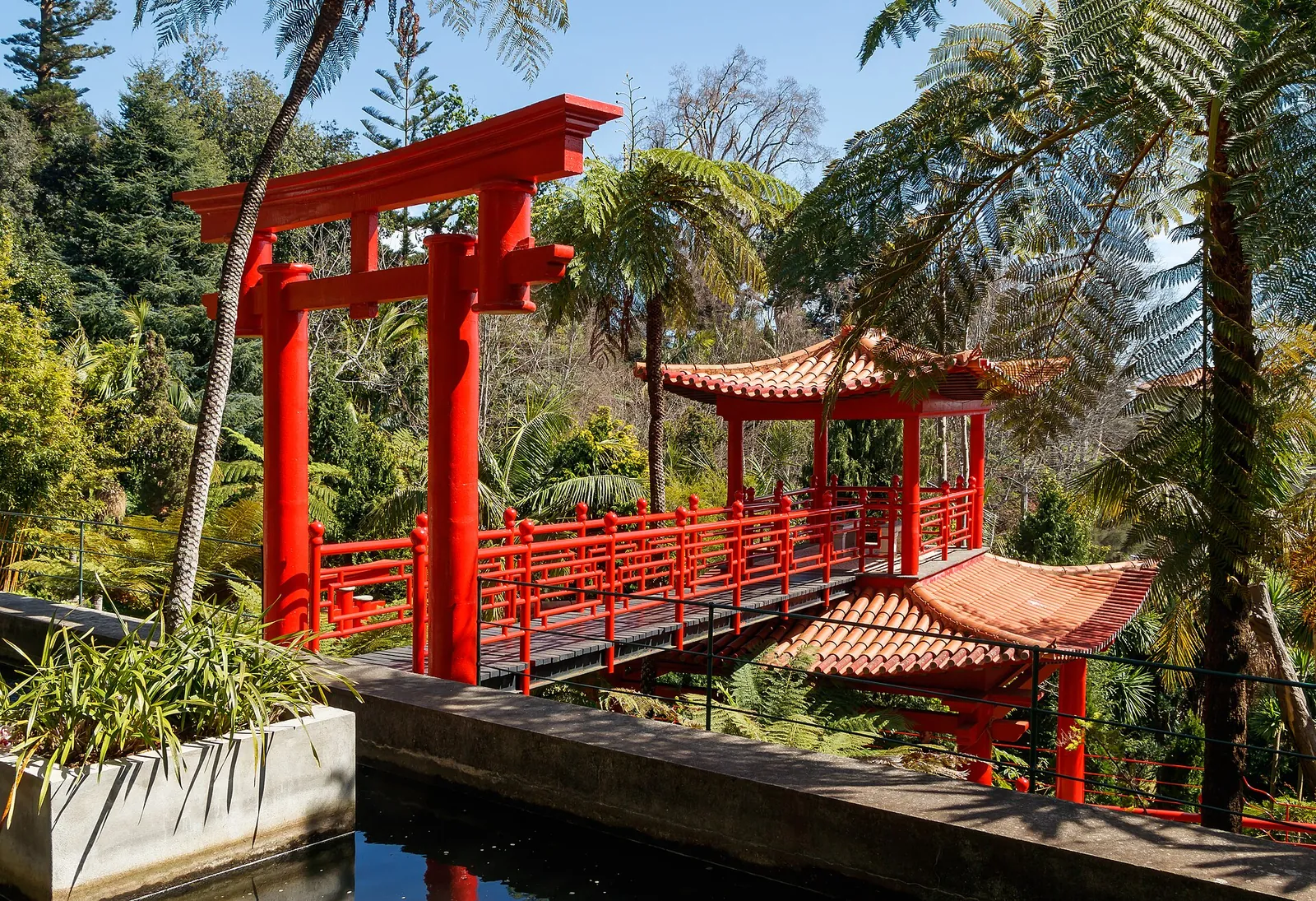 Red bridges and lush greenery in Monte Palace Tropical Garden