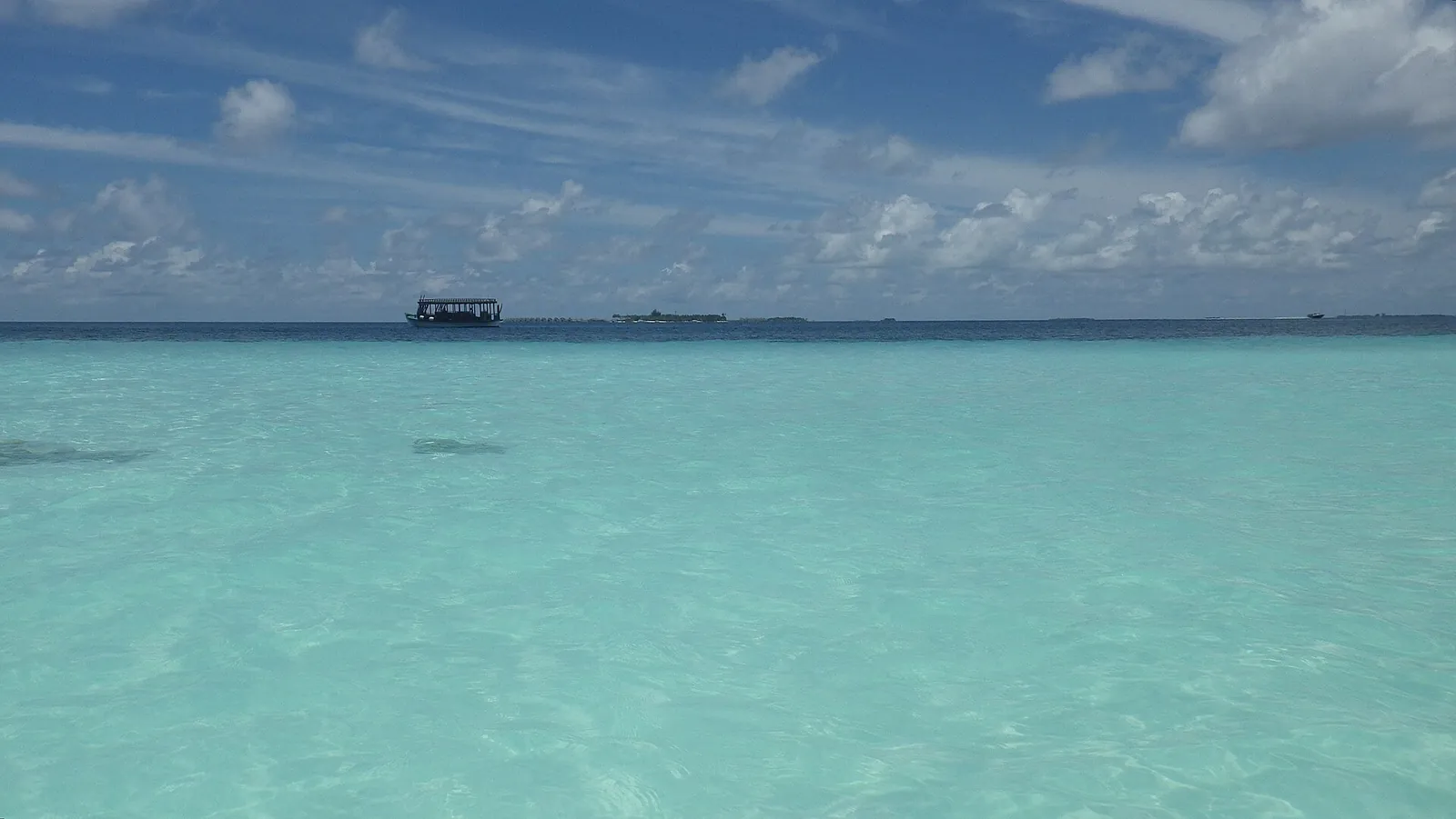 Clear turquoise shallows stretching to the horizon