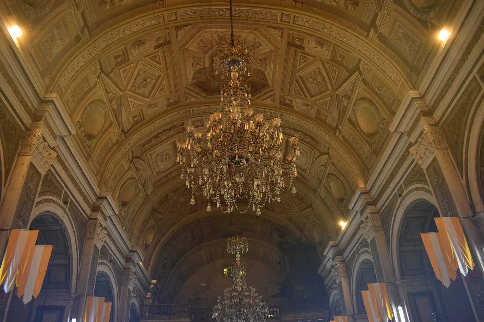 Chandeliers and painted ceiling inside San Agustin Church