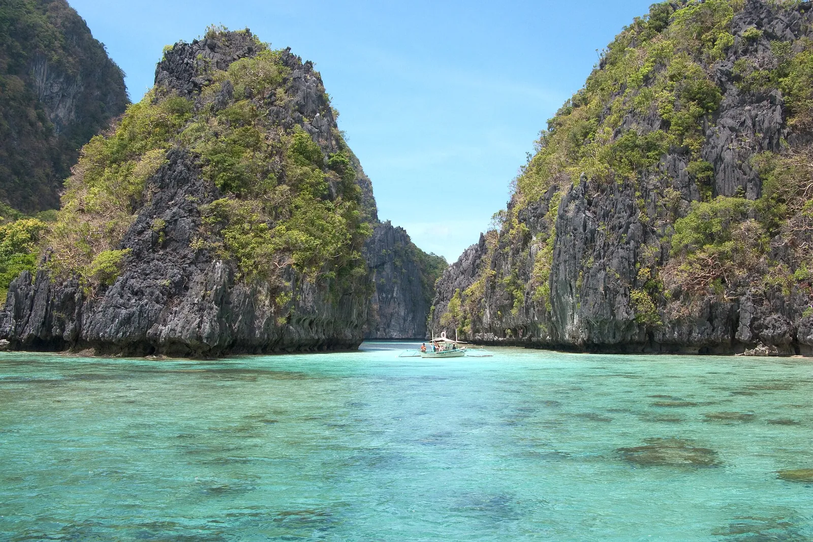 Limestone cliffs around a lagoon in Bacuit Bay
