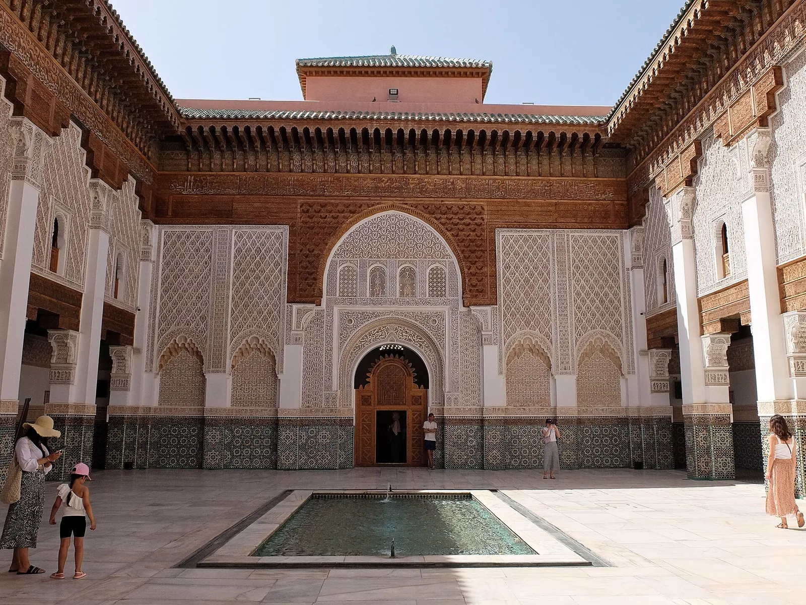 Tiled courtyard and pool of the Ben Youssef Madrasa