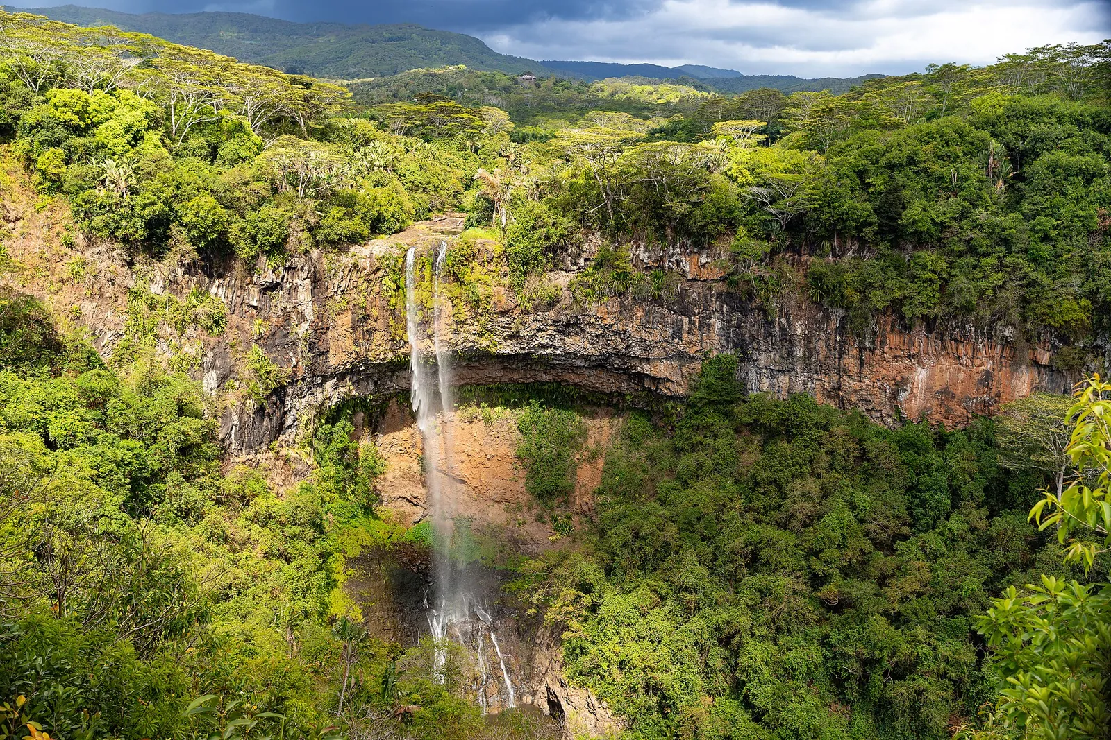 Chamarel Waterfall plunging into a green gorge