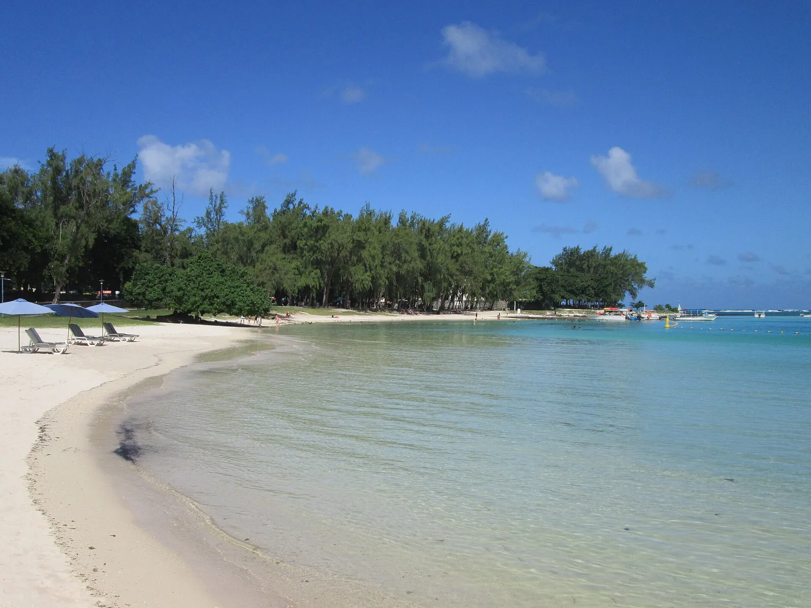 Calm turquoise water and white sand at Blue Bay
