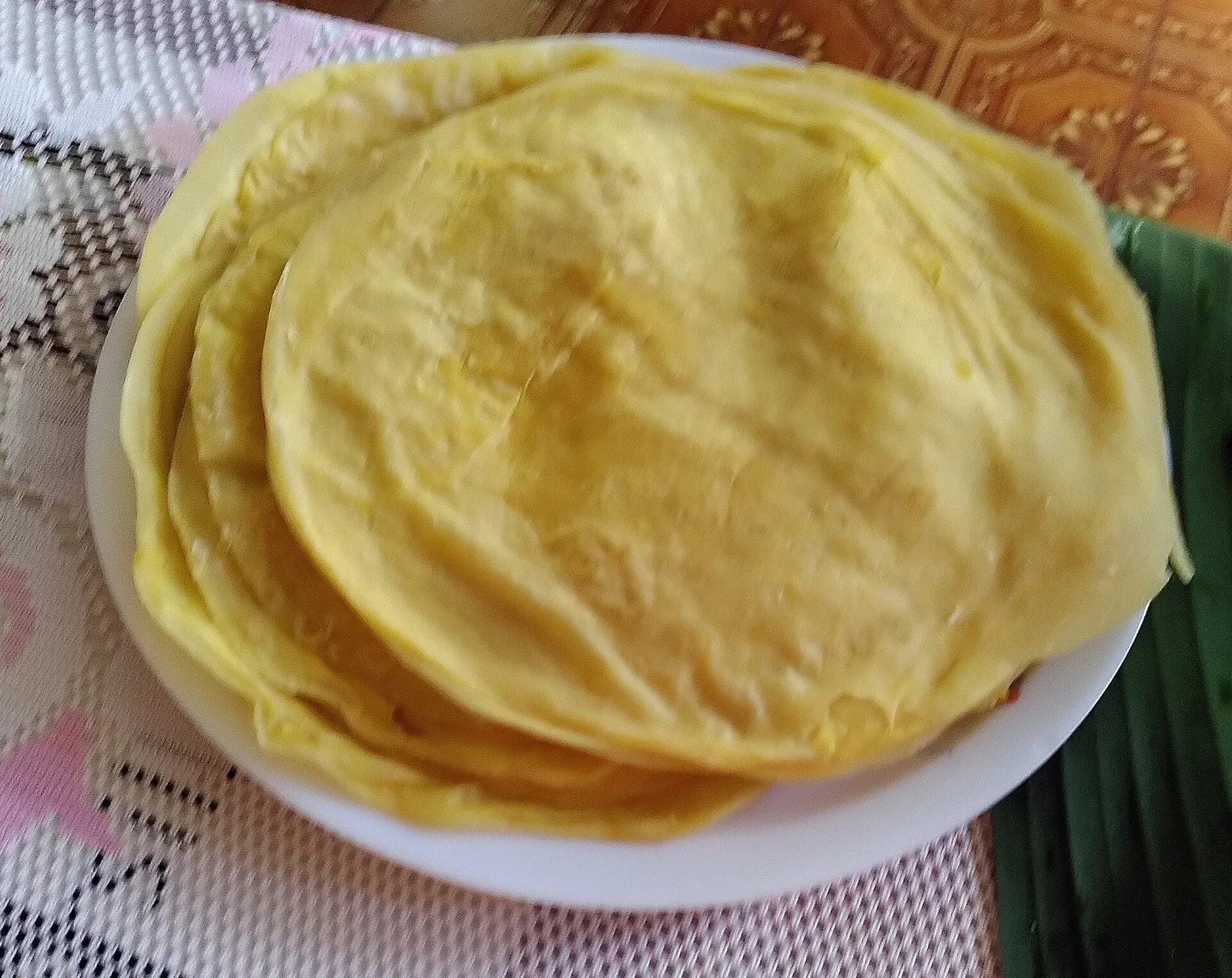 A stack of freshly made dholl puri flatbreads