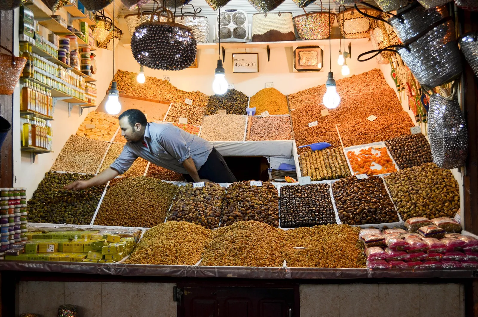 Dried fruit and nuts piled high at a Marrakech souk stall