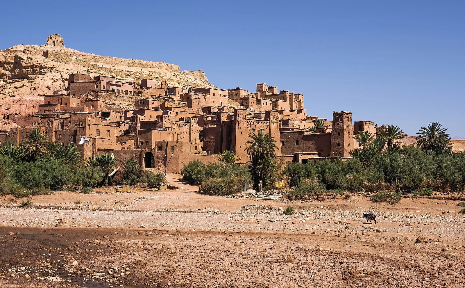 The earthen ksar of Aït Benhaddou under a blue sky