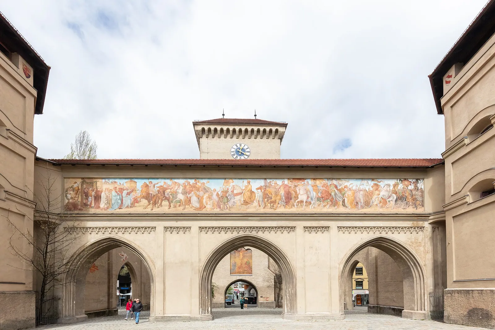 The painted Isartor city gate under blue sky