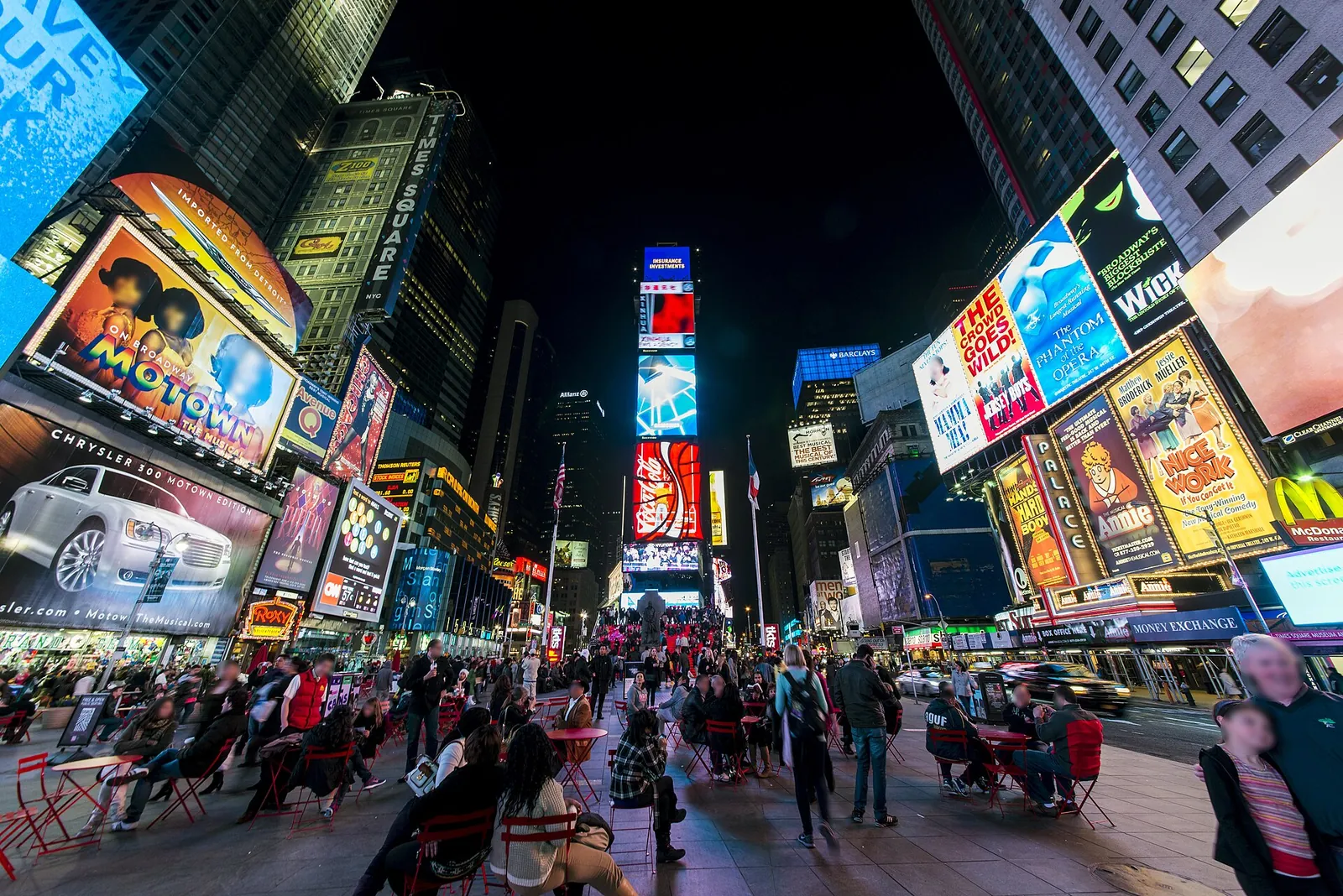 Times Square glowing with neon billboards at night