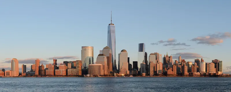 Lower Manhattan skyline glowing in golden afternoon light