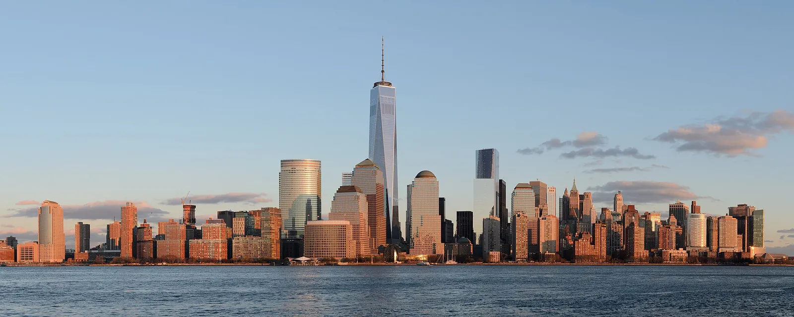 Lower Manhattan skyline glowing in golden afternoon light