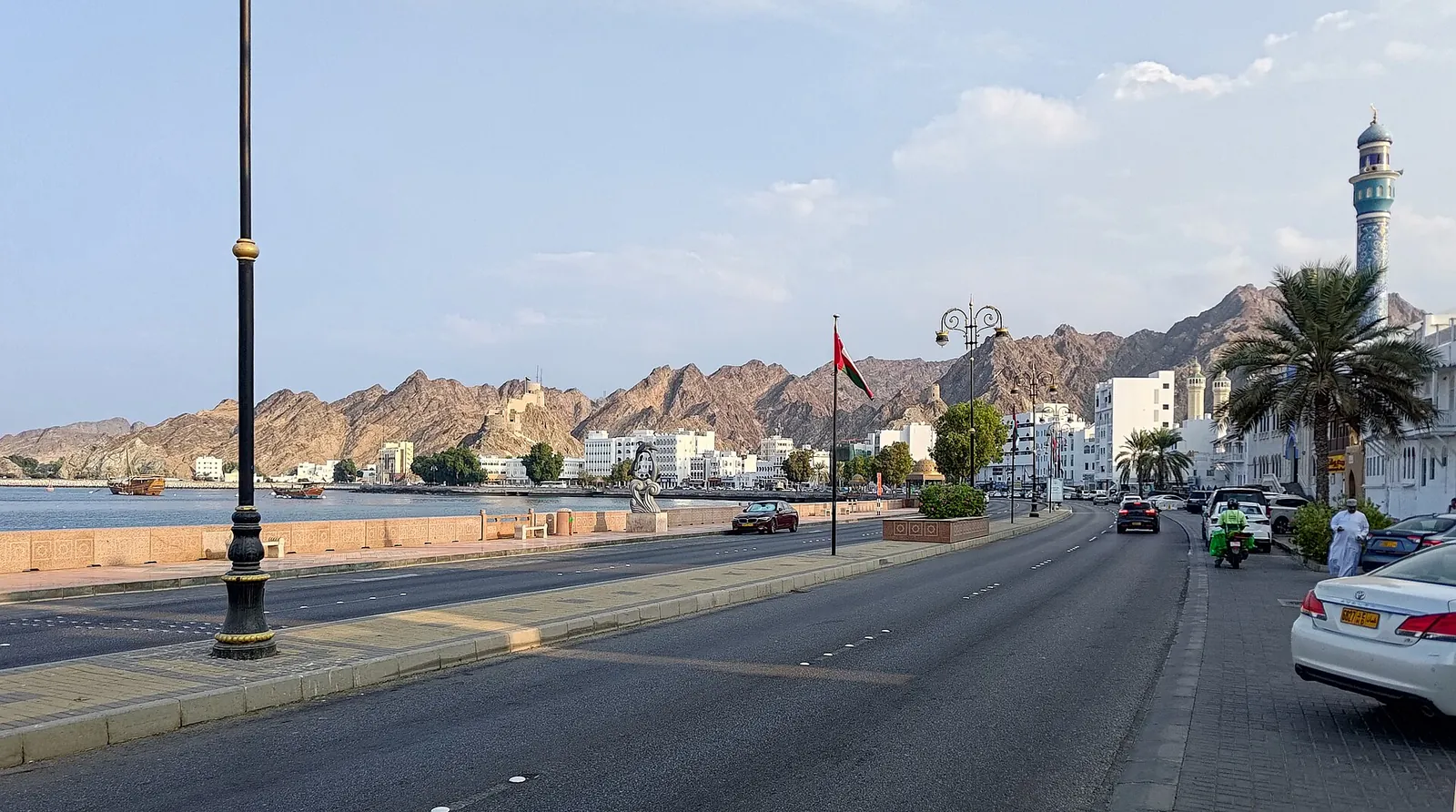 The palm-lined Mutrah corniche on a sunny day
