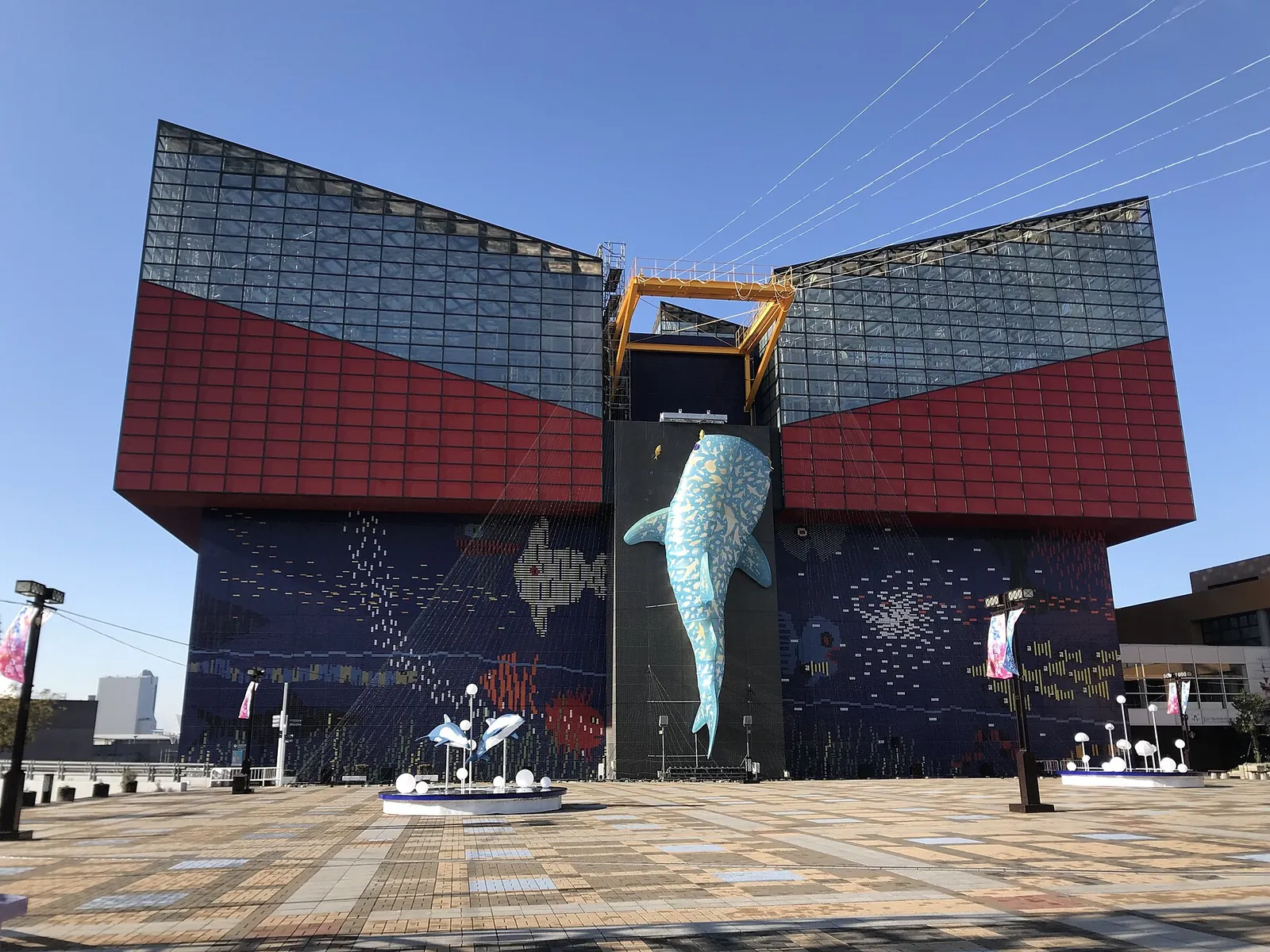 The colourful Osaka Aquarium Kaiyukan under blue sky