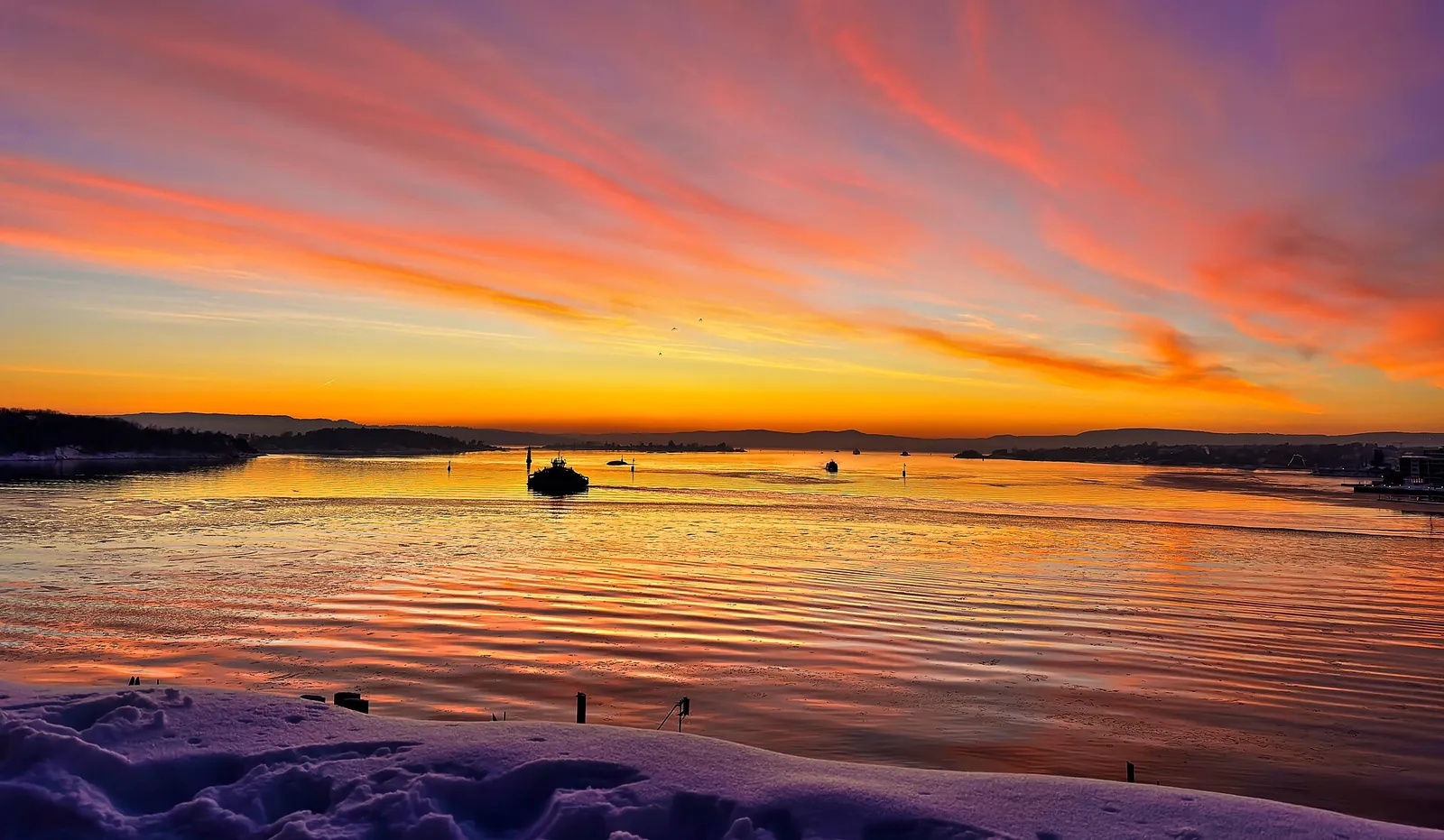 A glowing orange sunset over the Oslofjord
