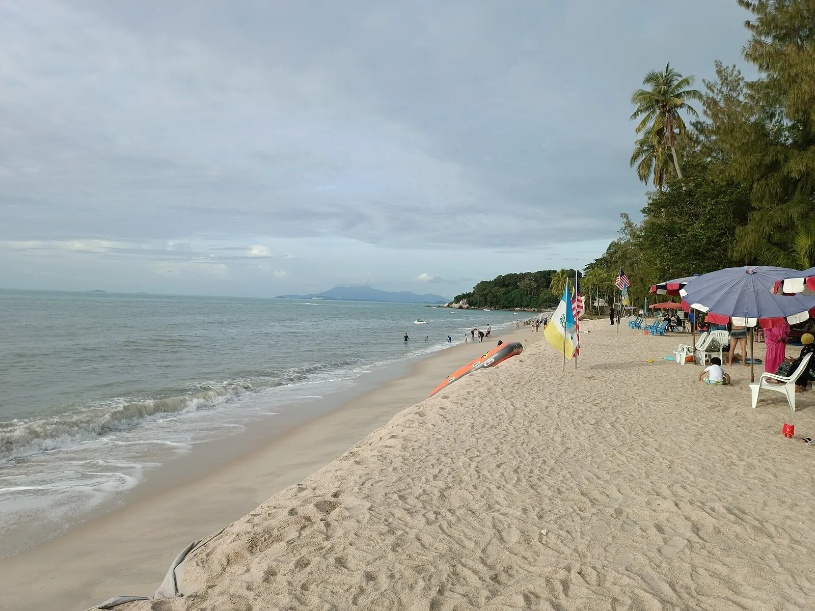 Palm-fringed sand at Batu Ferringhi beach
