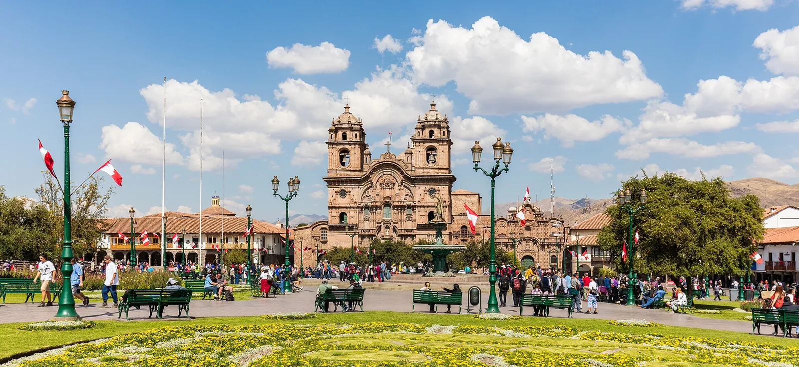 Cusco's Plaza de Armas under a big blue sky