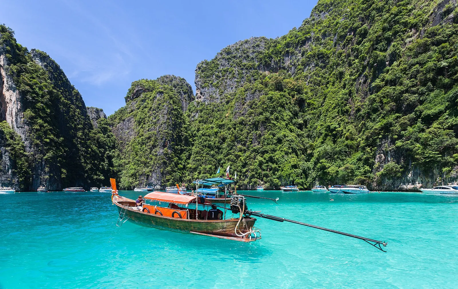 Longtail boat in turquoise water at Phi Phi Leh