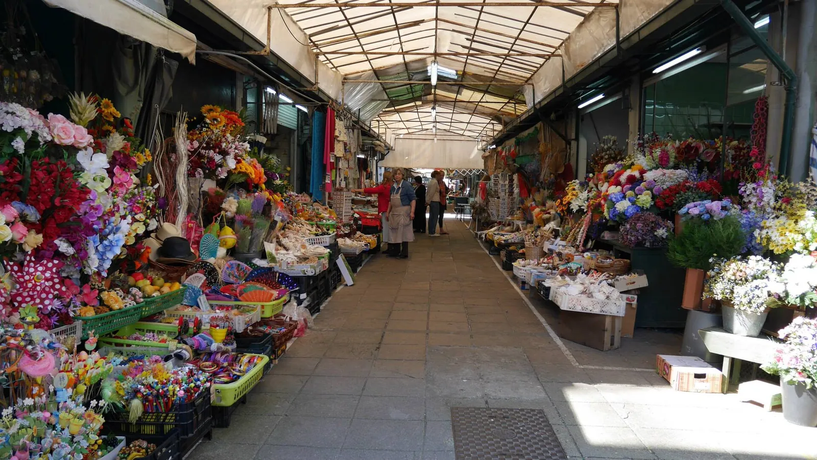 Flower stalls under the roof of Mercado do Bolhão