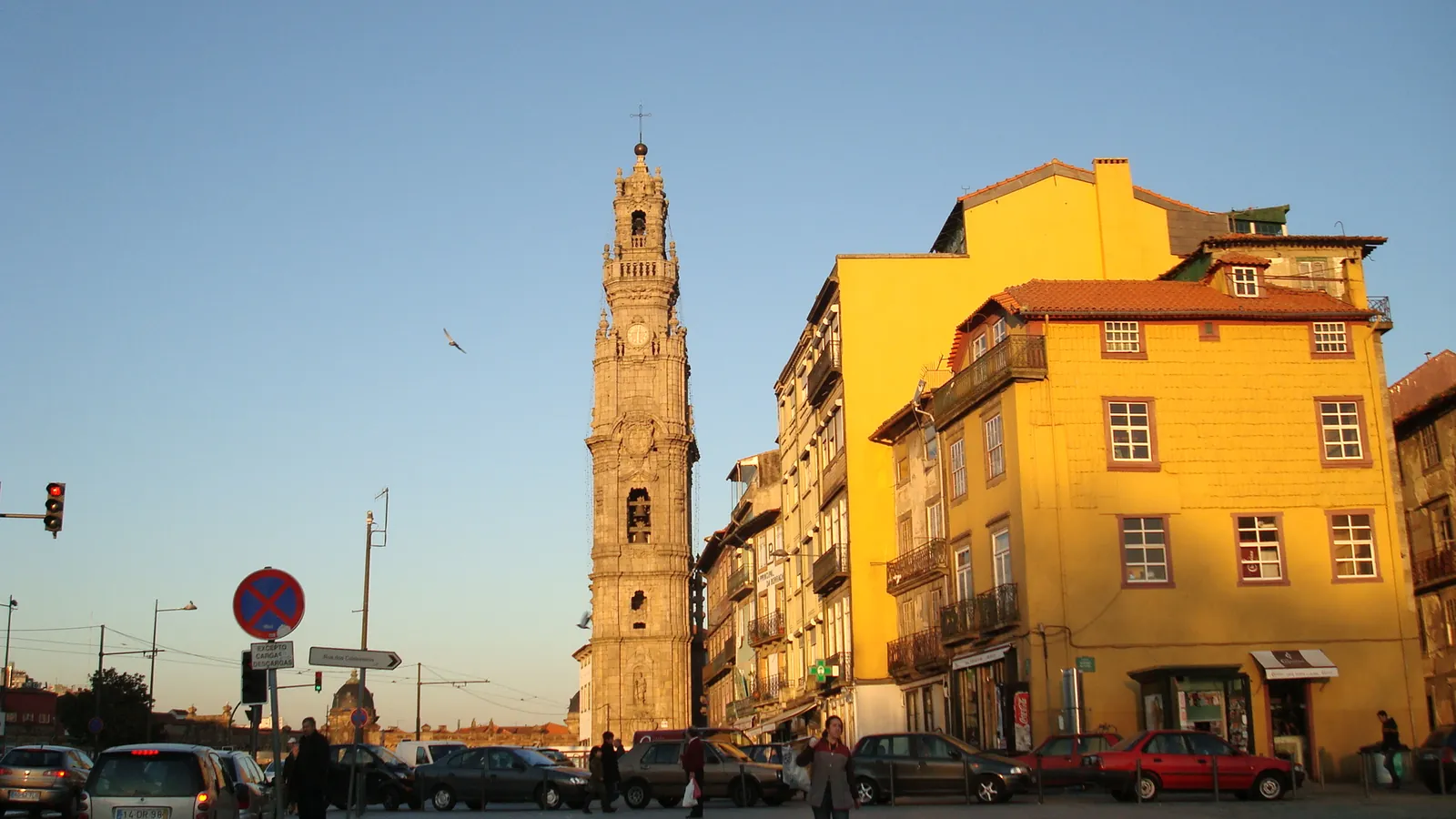 Torre dos Clérigos rising above a sunny yellow facade
