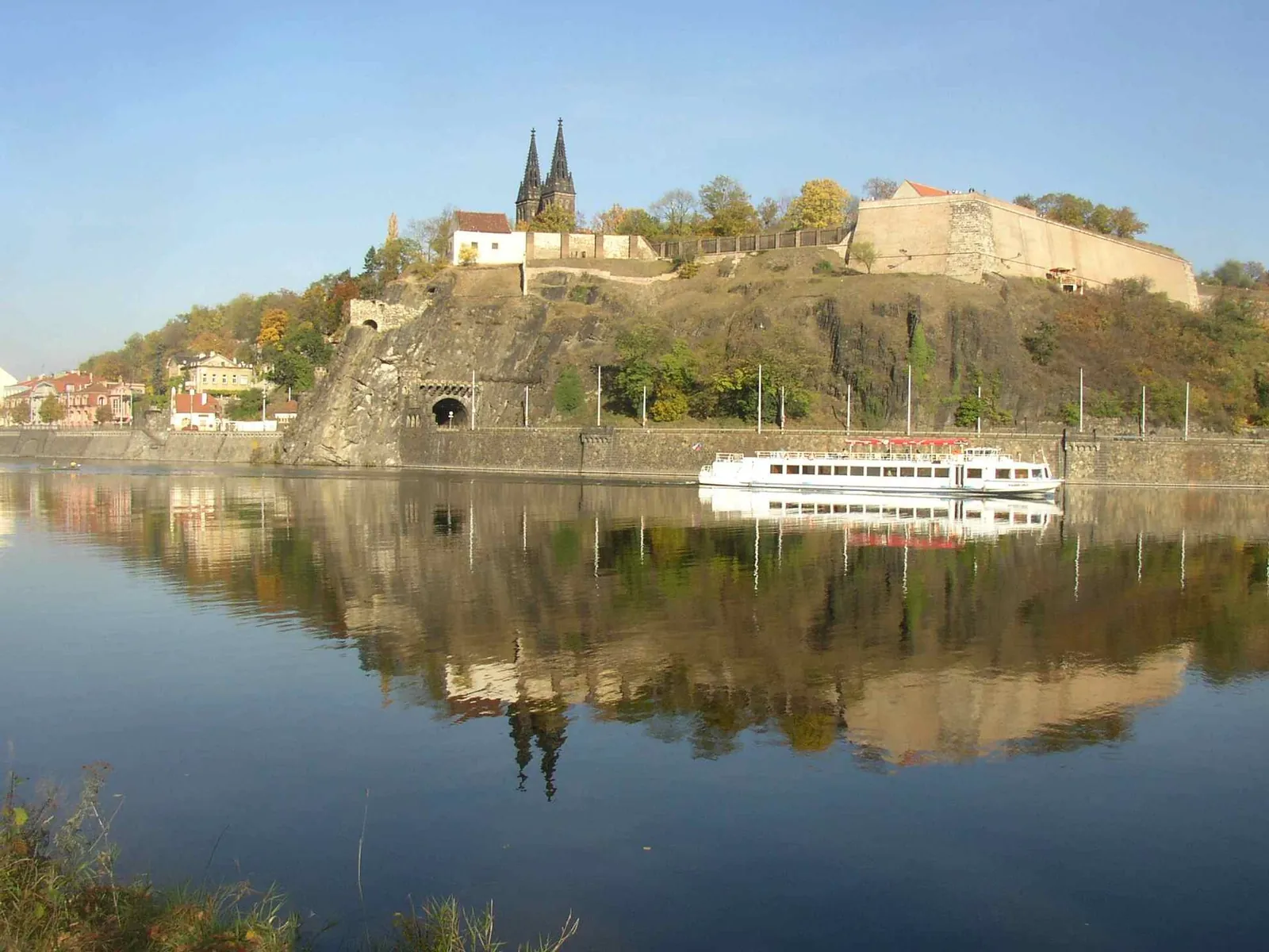 Vyšehrad's twin spires reflected in the Vltava