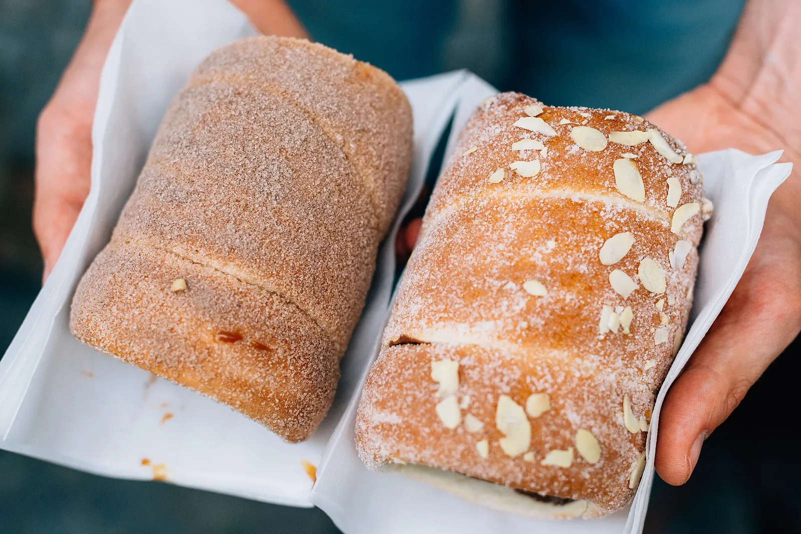 Two sugar-dusted trdelník pastries