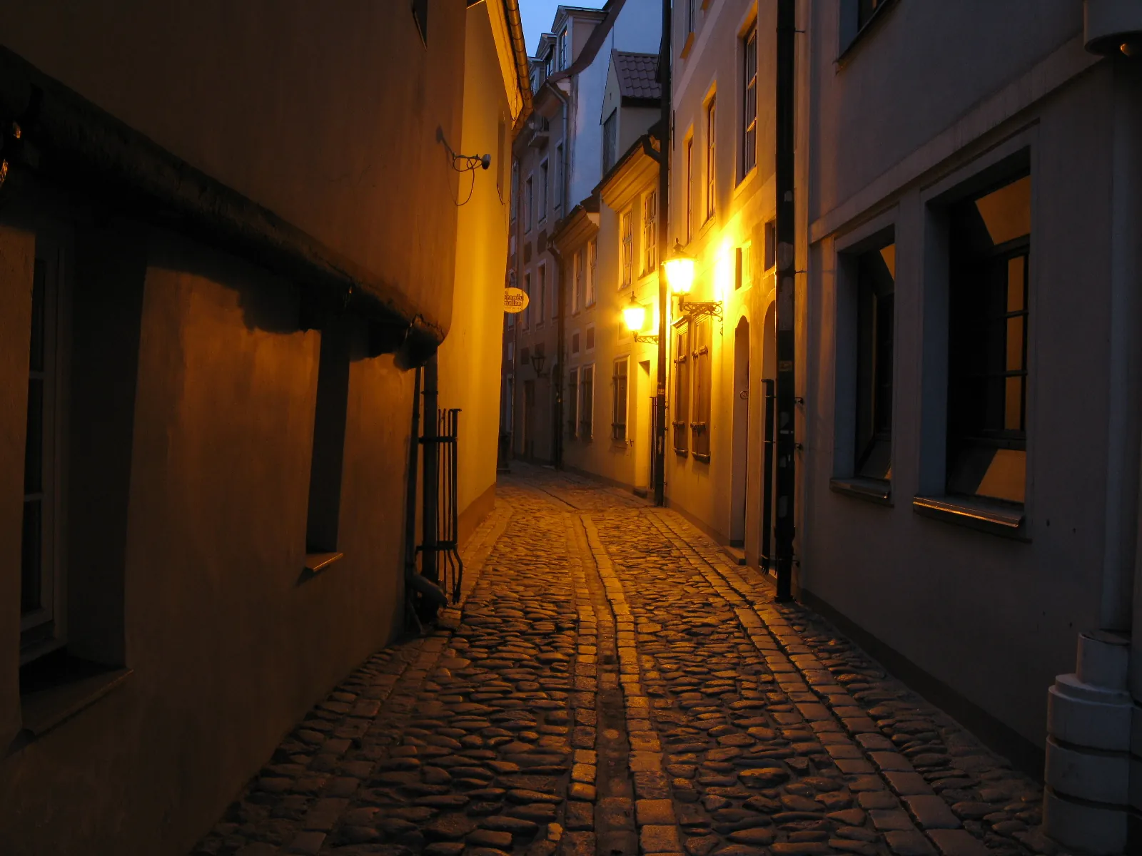 A lamplit cobbled lane in Riga's Old Town
