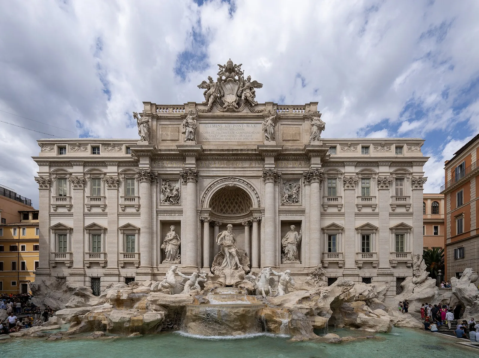 The Trevi Fountain shining under a bright sky