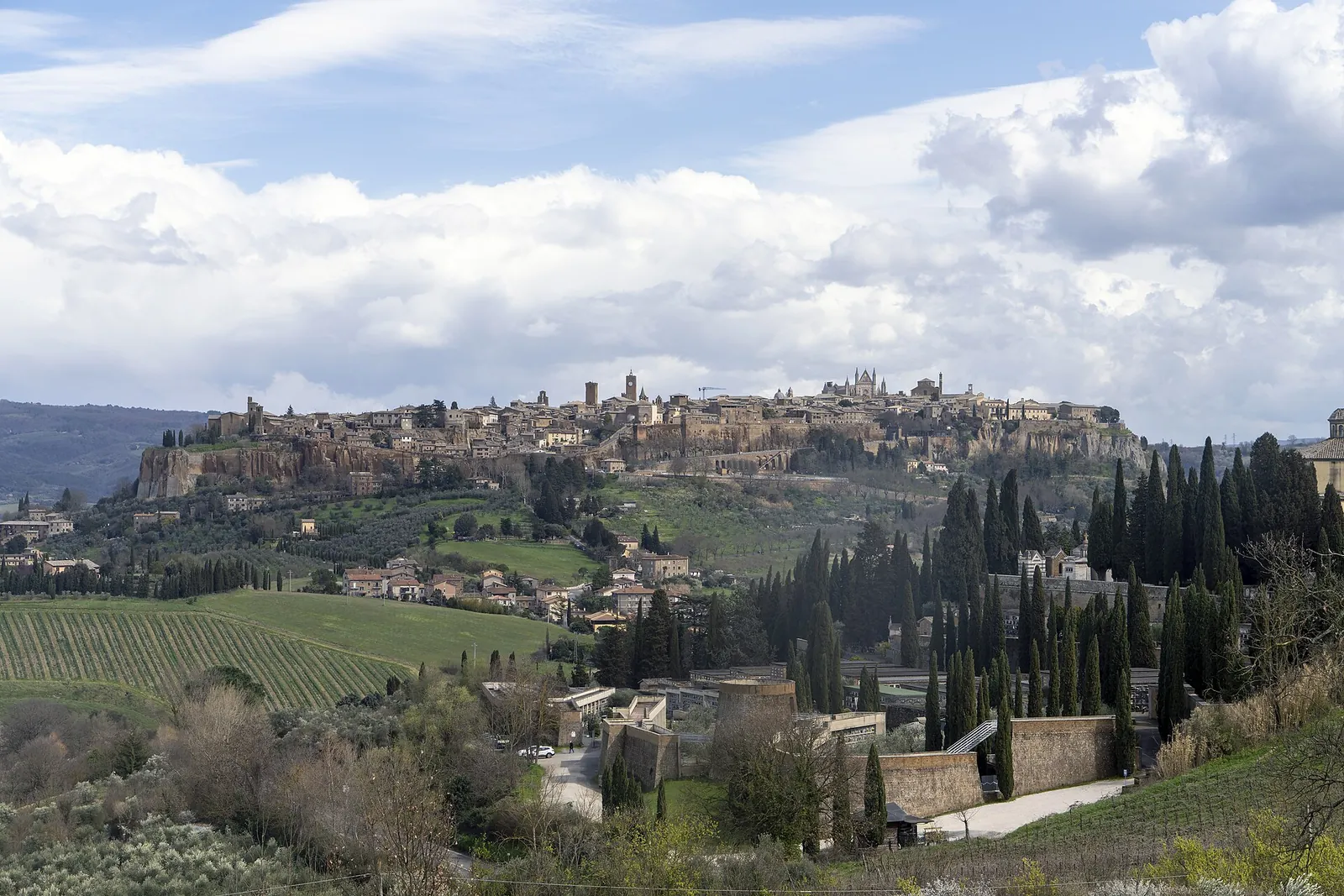 Orvieto perched on its cliff above green countryside