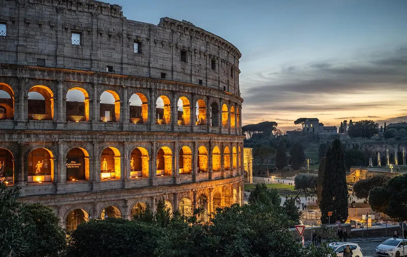 The Colosseum glowing in golden evening light