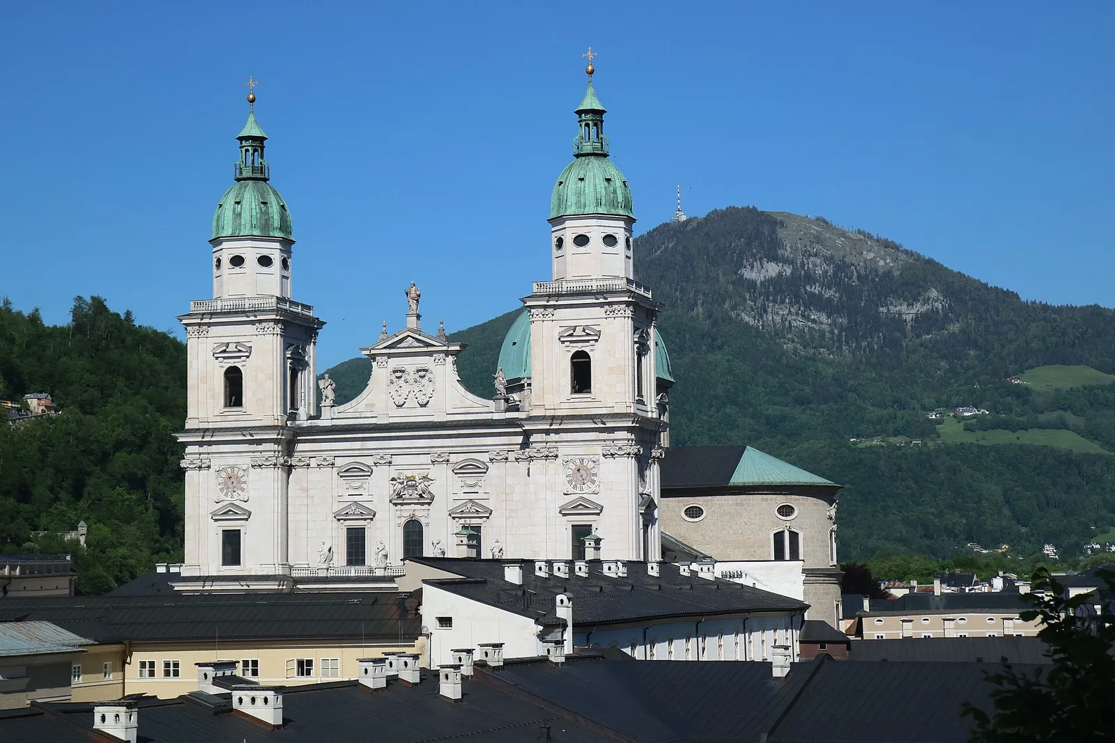 Salzburg Cathedral's green domes below the hills