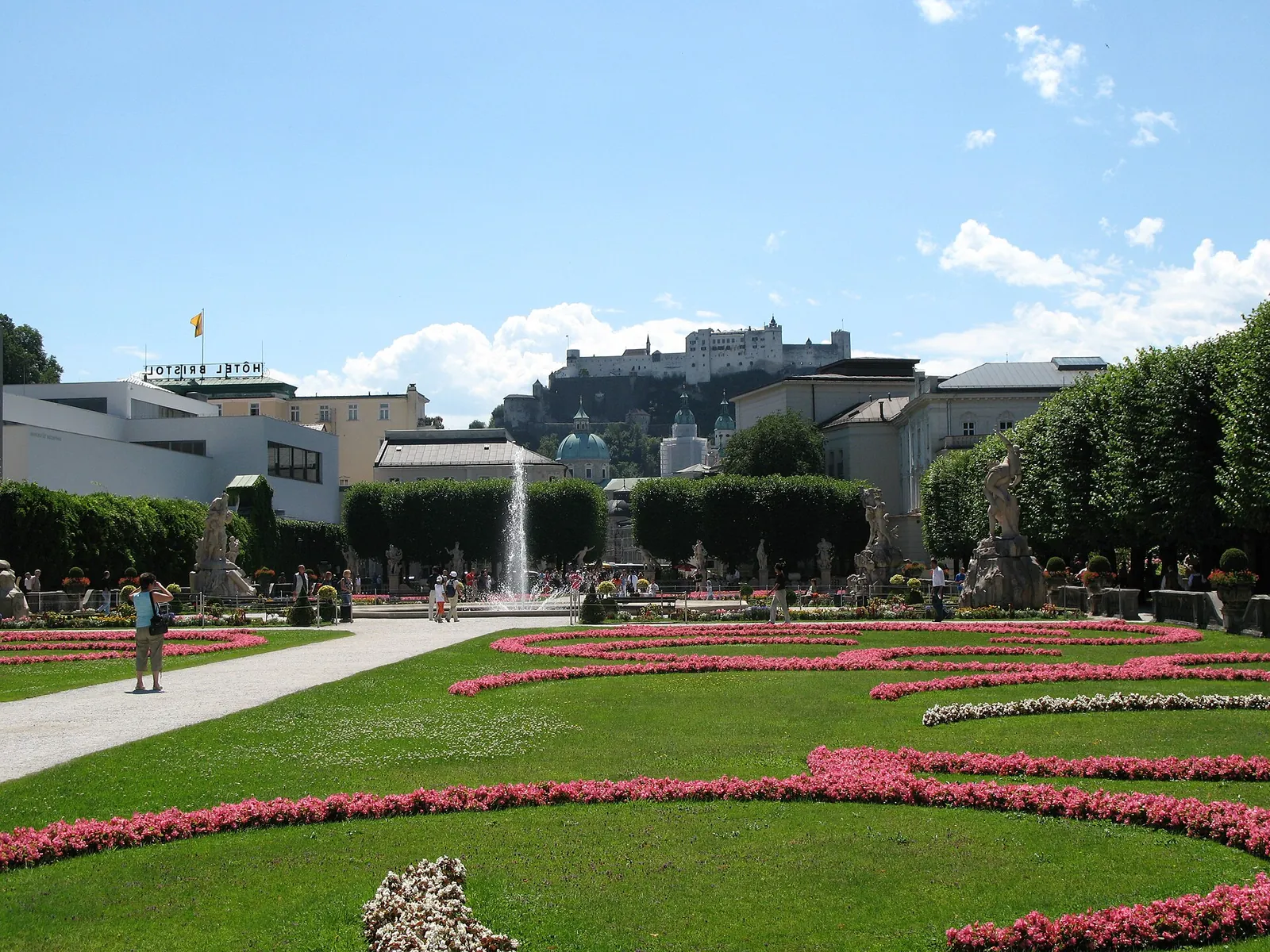 Flower beds in Mirabell Gardens with the fortress beyond