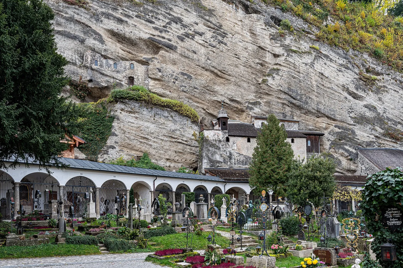 Flower-filled St. Peter's Cemetery beneath the cliff