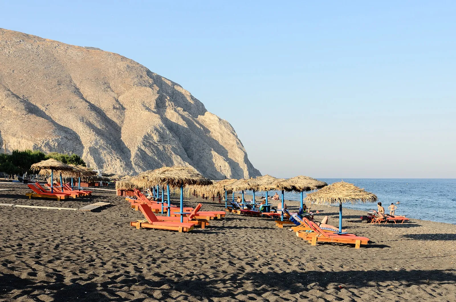 Black-sand Perissa beach under the Mesa Vouno cliff