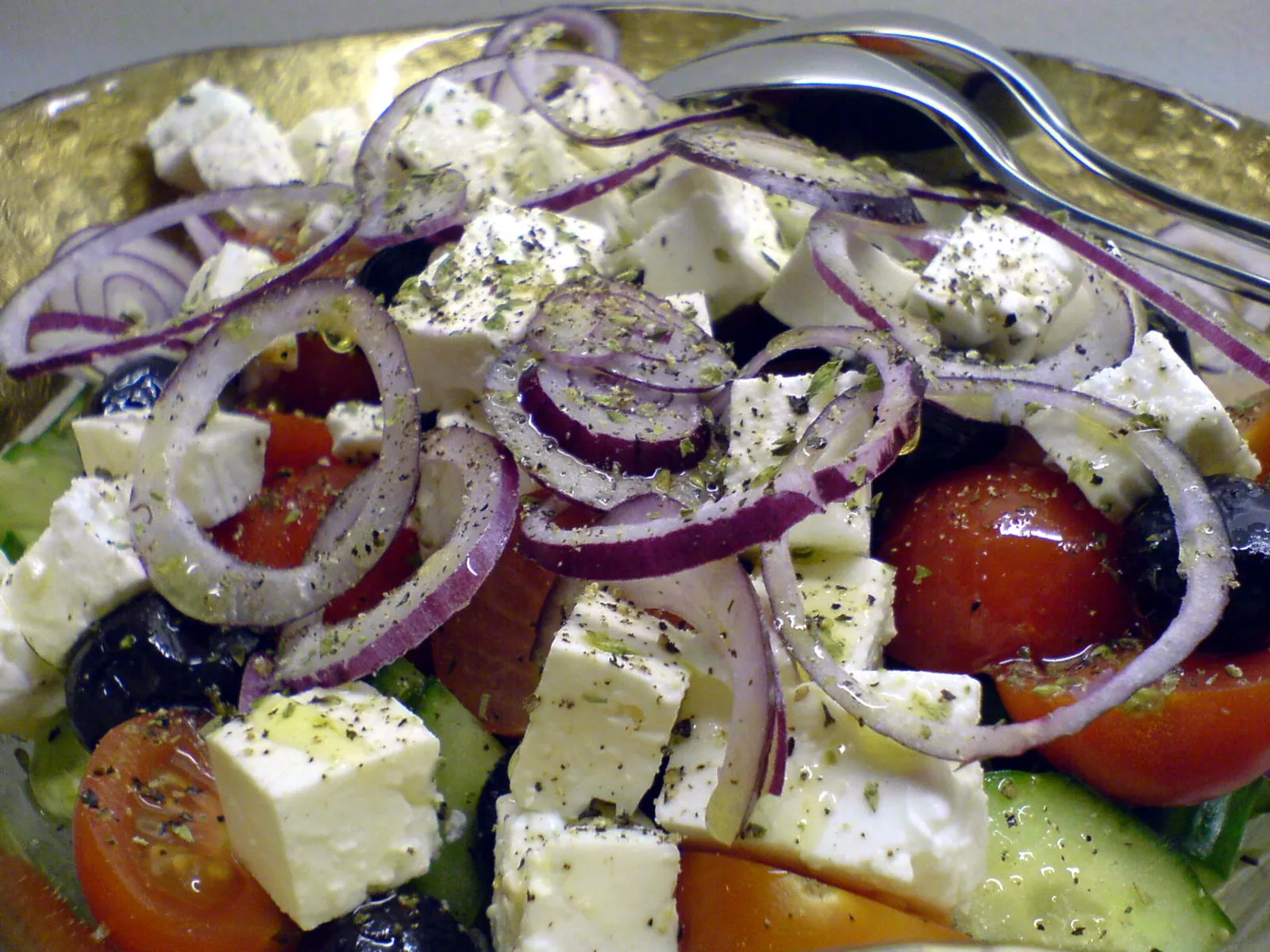 A colourful Greek salad topped with feta