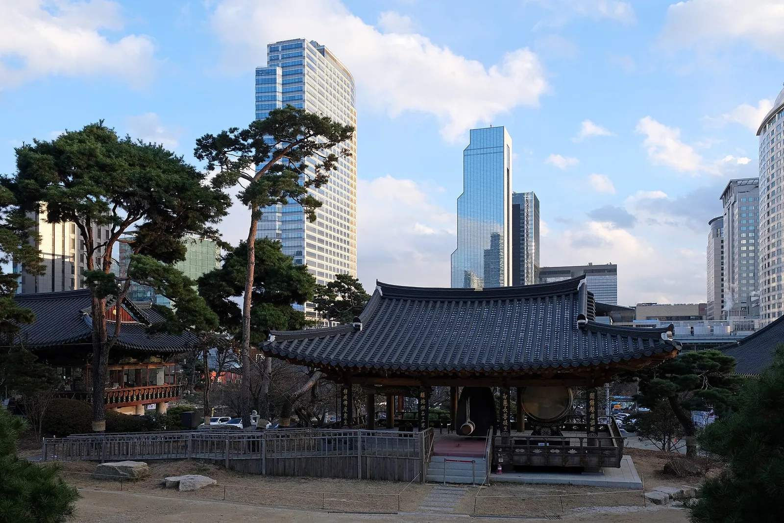 Bongeunsa Temple hall with Gangnam towers behind