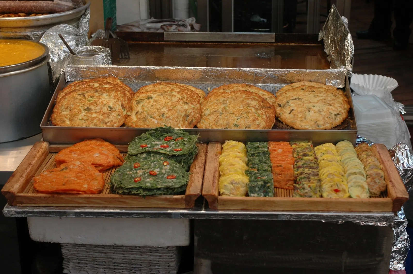 Golden jeon pancakes piled high at Gwangjang Market