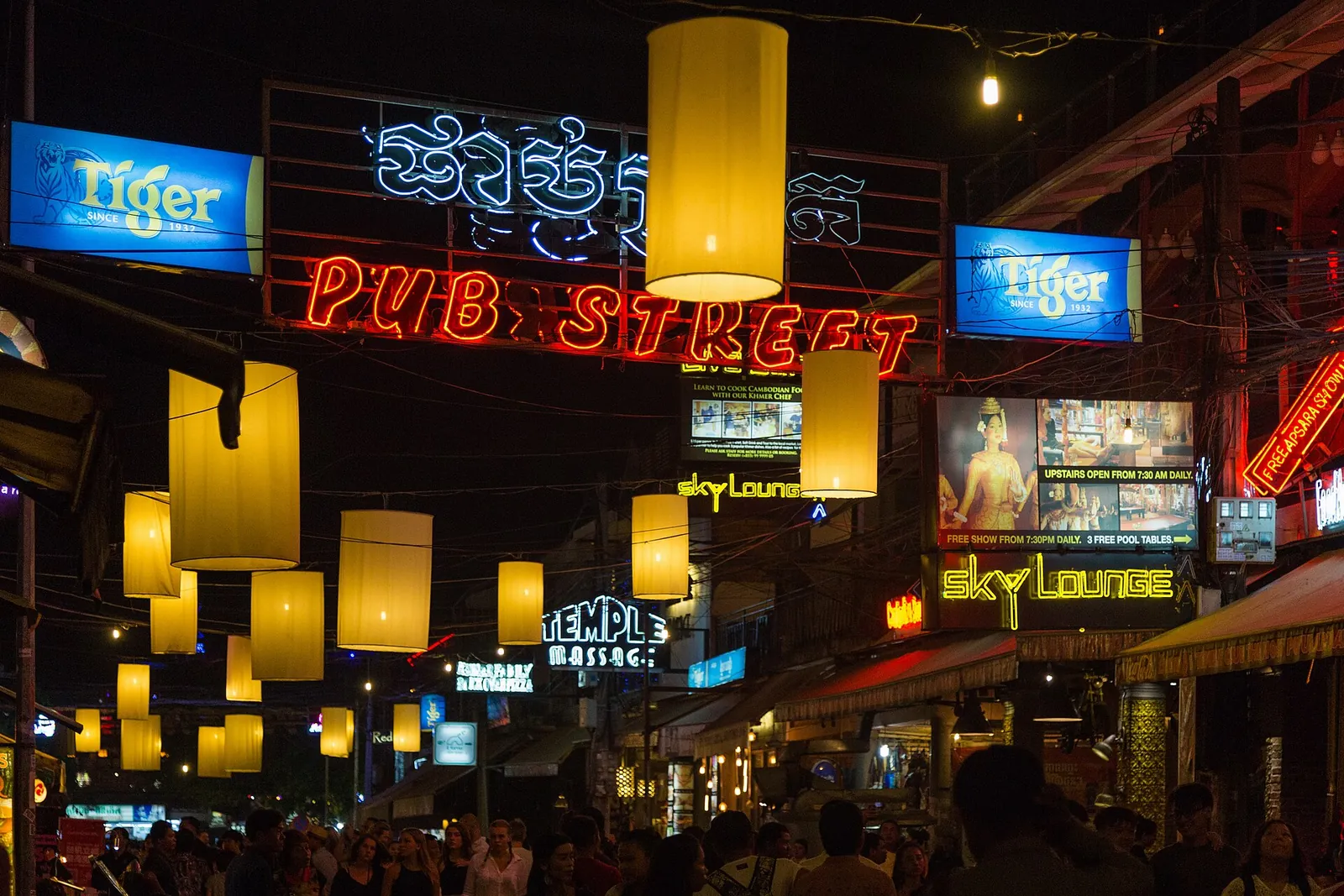 Glowing lanterns over Pub Street at night