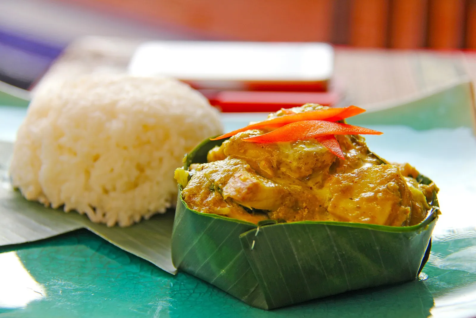 Fish amok in a banana-leaf cup with rice