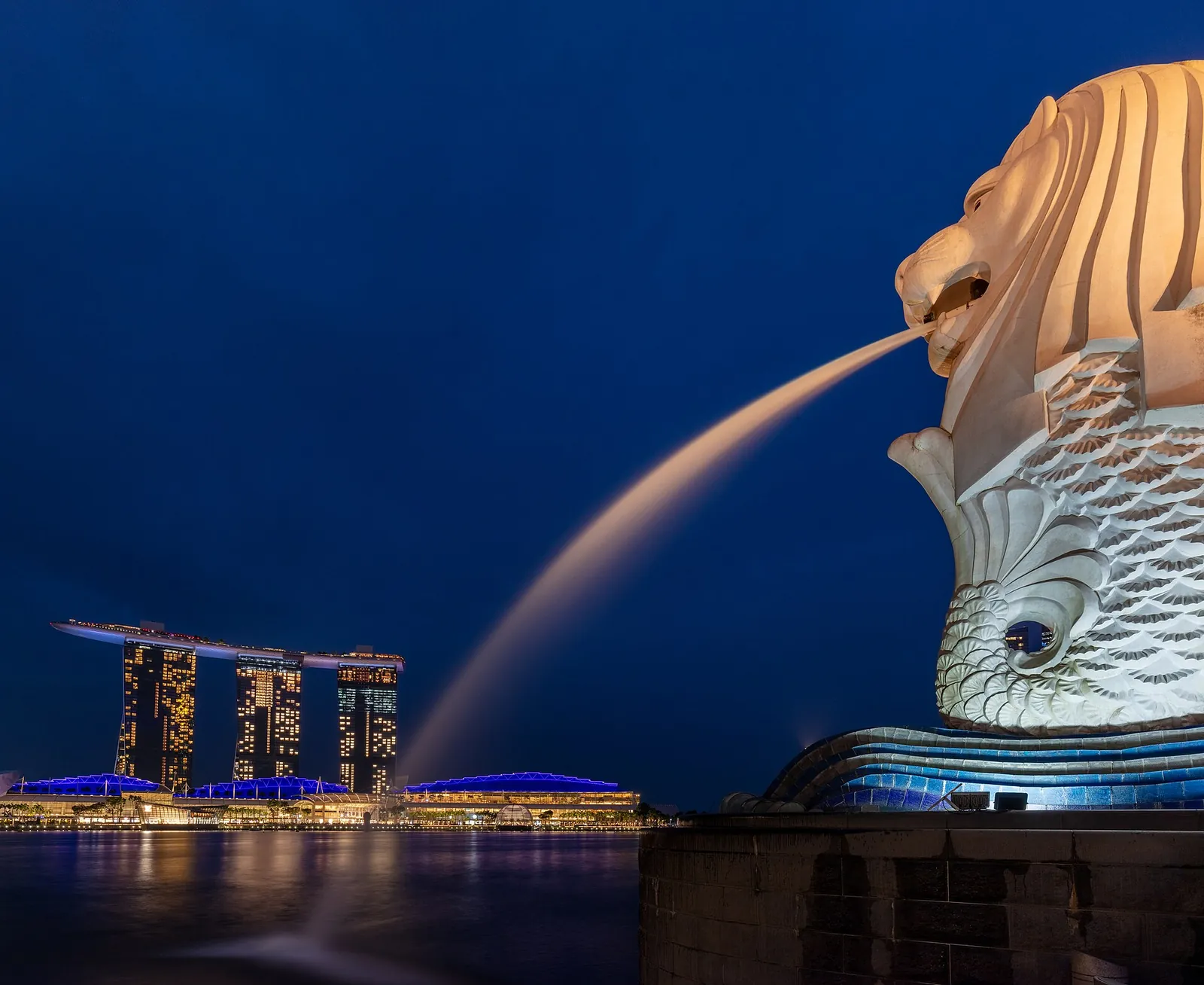 The Merlion facing Marina Bay Sands at blue hour