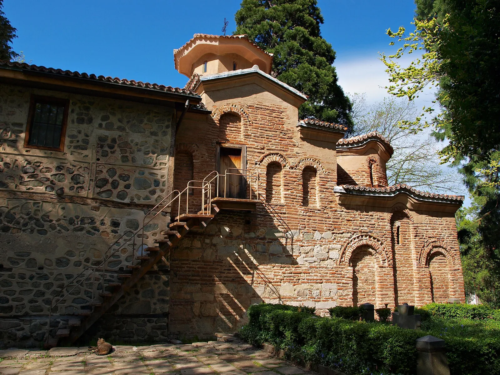 The little medieval Boyana Church among green trees