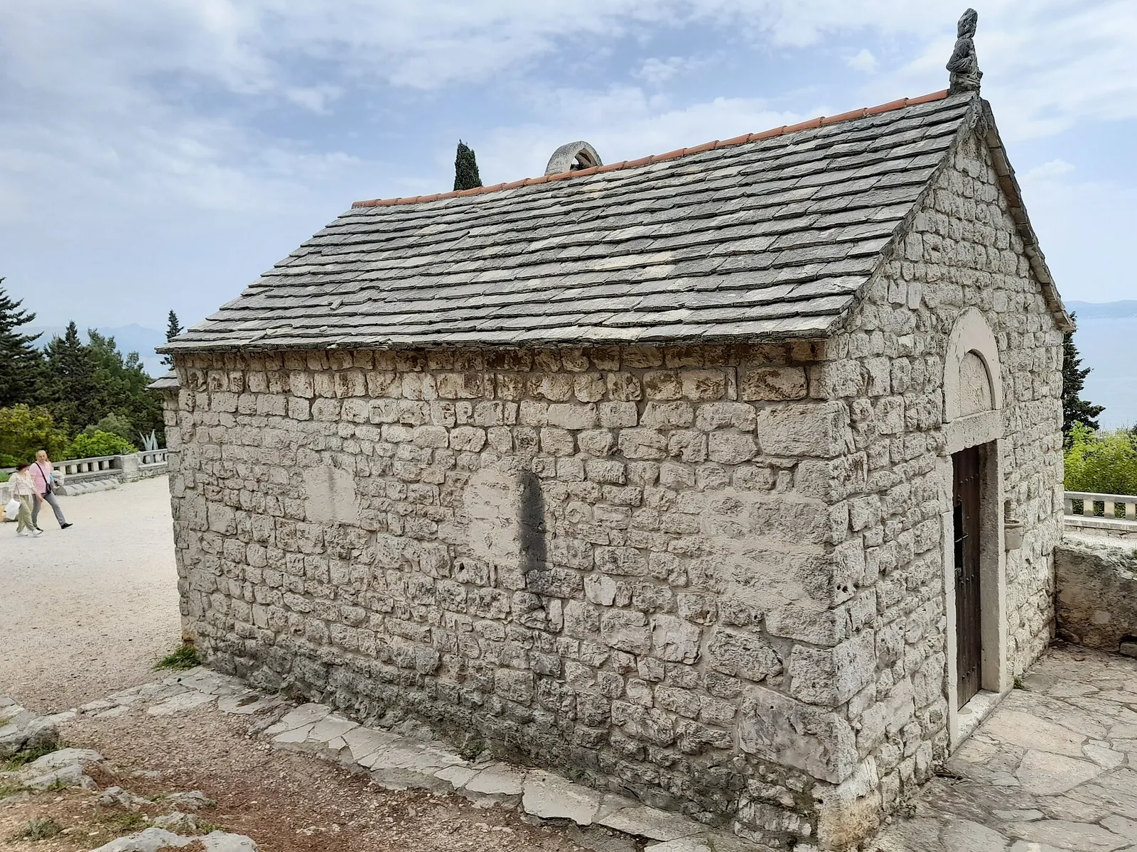 A little stone chapel on Marjan hill under blue sky